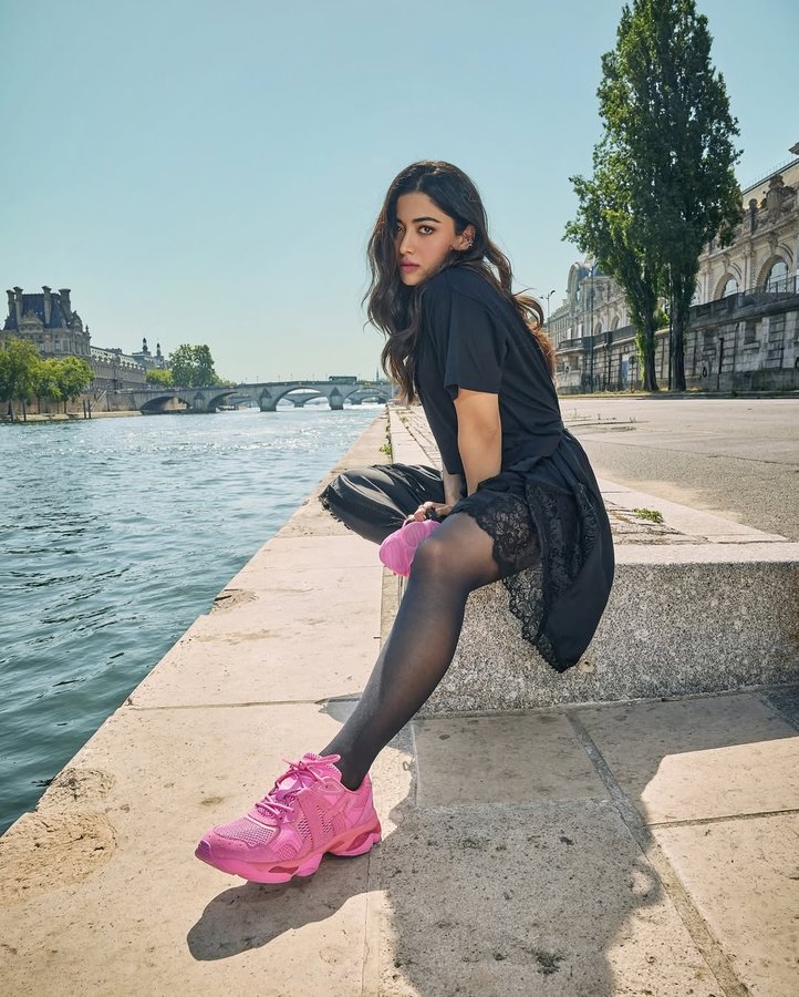 Instagram post by @rashmika_mandanna for Onitsuka Tiger. Caption reads: Just slipped into my new TIGRUNs from the ULTI RS....