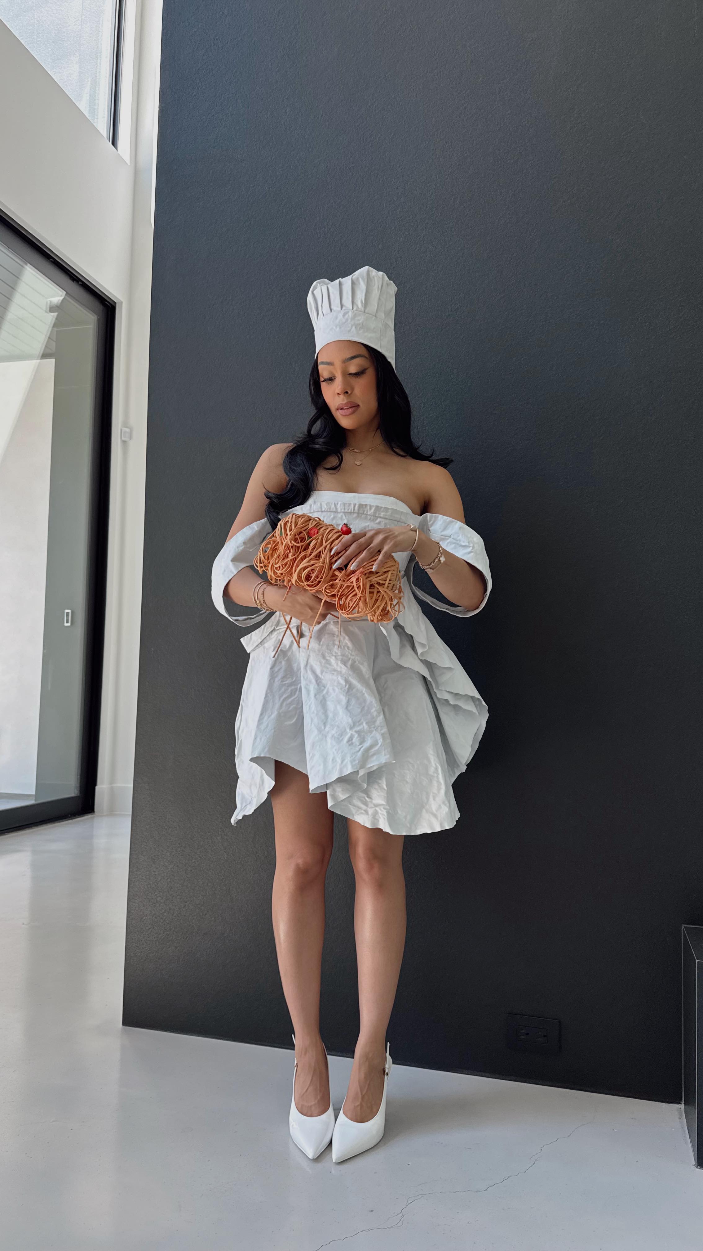 Instagram post by @kristy.sarah for Moschino. Caption reads: [...] 🍝 my new spaghetti bag #suppliedby....