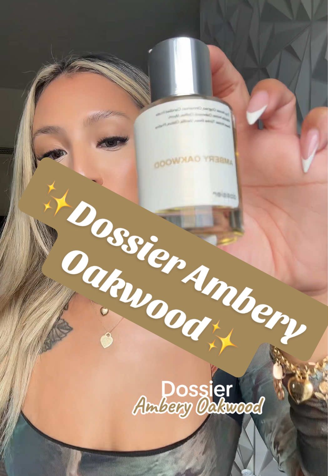 TikTok post by @giniglow for Dossier. Caption reads: 🤎🪽✨It’s giving Angel’s Share✨#dossierperfumes....