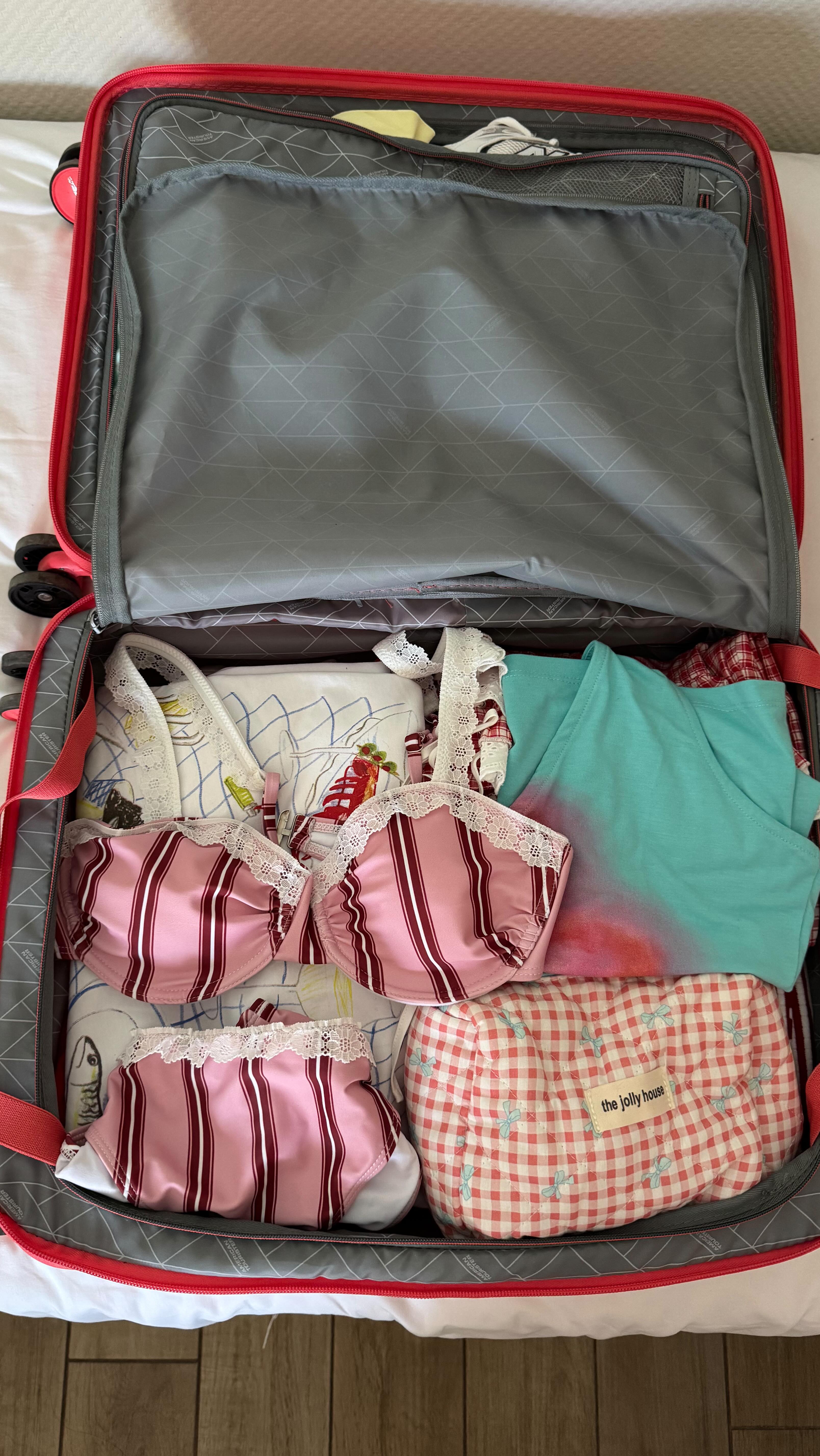 Instagram post by @annkurtoglyan for American Tourister. Caption reads: Perfect summer begins with perfect suitcase 🤍....