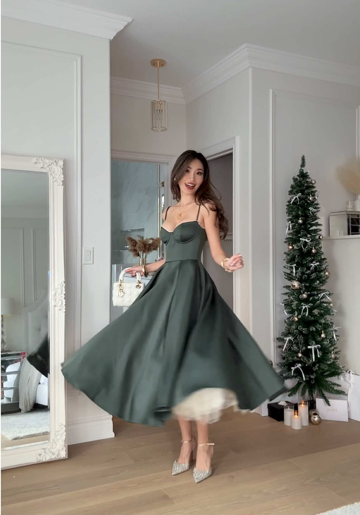 TikTok post by @kerina.wang for House of CB. Caption reads: THE original Christmas dress 🌲 from @houseofcb, a....