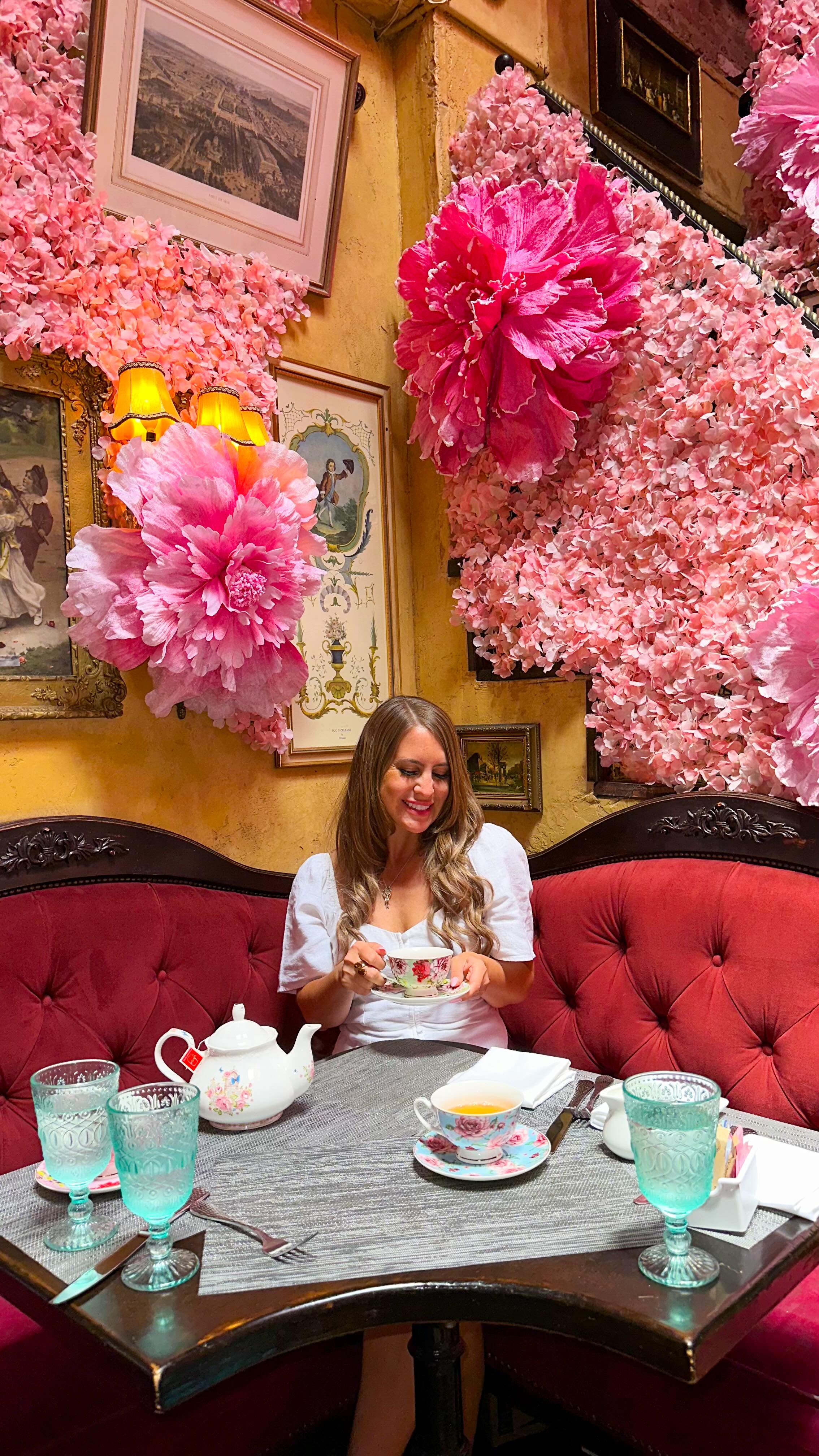 Instagram post by @girlin3a for Girls LOVE Travel®. Caption reads: Stepped into a floral dream at Lillie’s Victorian....