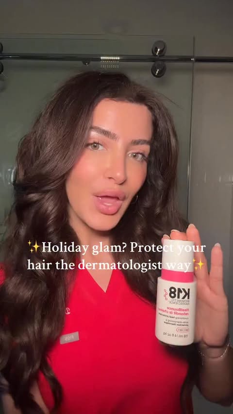Instagram post by @beautydermmd for K18 Hair. Caption reads: Holiday glam? Always. Heat damage? No thanks. 🫶🏼....