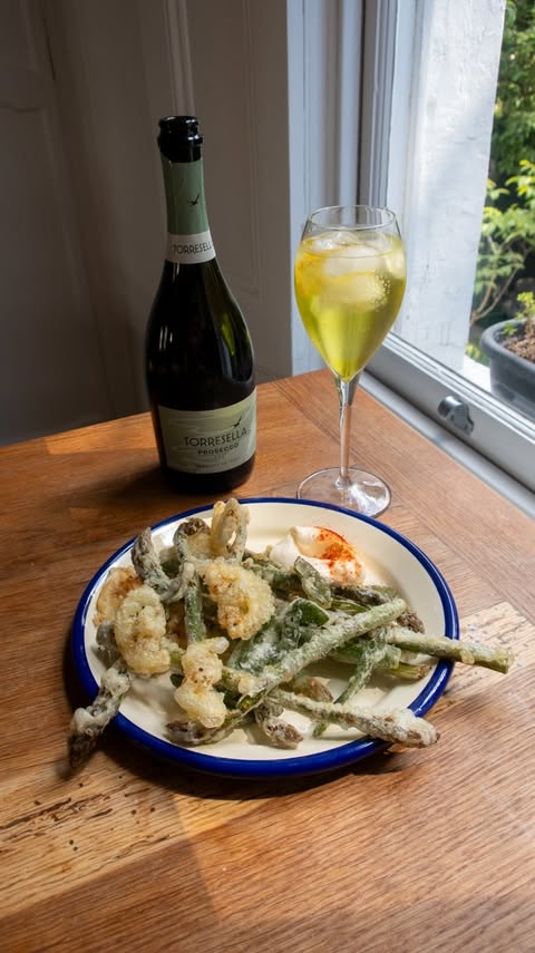 Instagram post by @georgieeats for Prosecco DOC. Caption reads: ad asparagus fritti, lemon, sage and a....