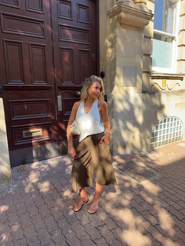 Instagram post by @izziekxx for NA-KD. Caption reads: Not ready to stop summering 🥲🍒⭐️ @nakdfashion....