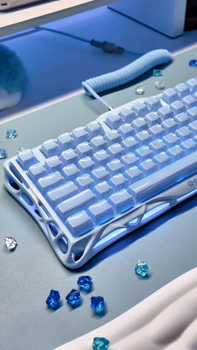 Instagram post by @softlywiredx for GravaStar. Caption reads: [...] the Ice Blue Mercury K1 keyboard by....