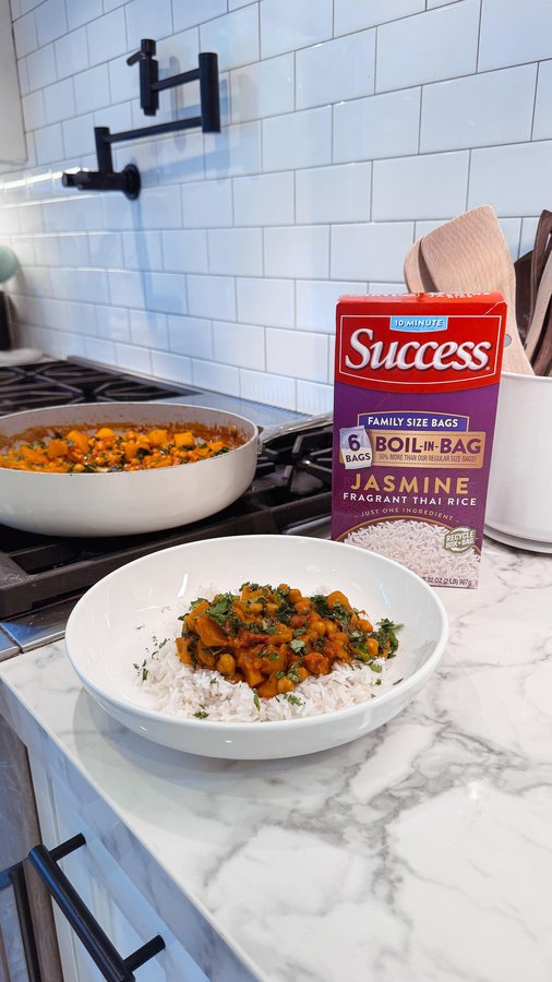 Instagram post by @nataliecamilay for Success Rice. Caption reads: #AD @successrice This cozy one-pan curry has been....
