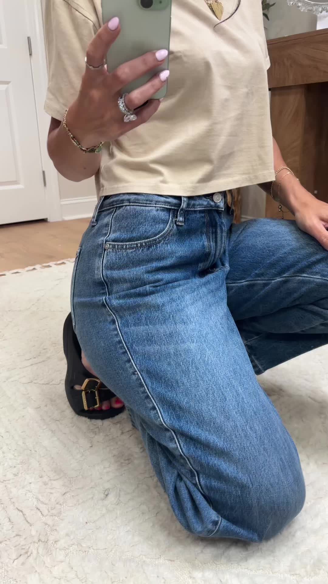TikTok post by @nicolenikkinic for Walker Rose Boutique. Caption reads: #judyblue #jeans #momjeans @Walker Rose Boutique.