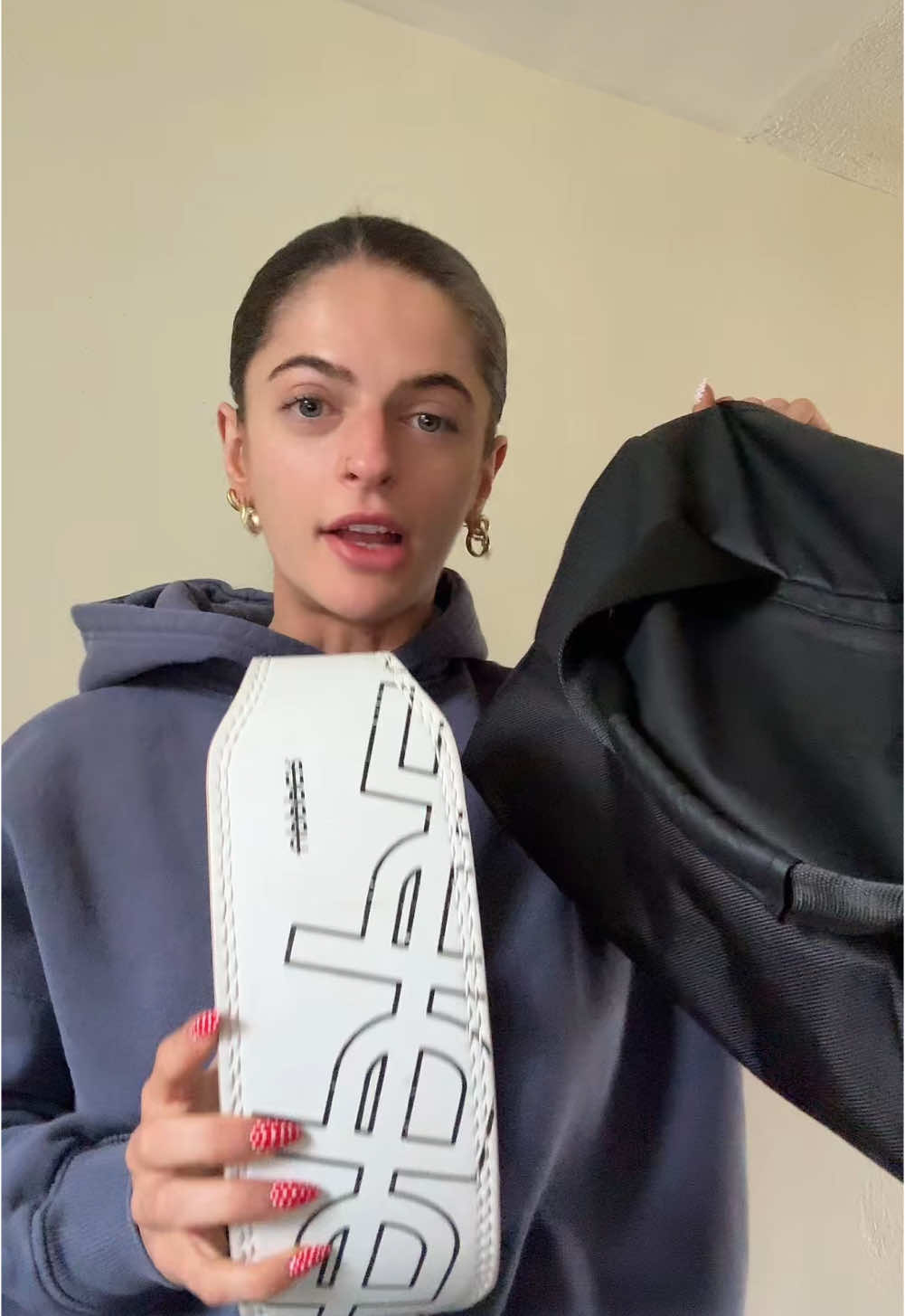 TikTok post by @fitby.ash for UPPPER. Caption reads: do you need a lifting belt? yes. from @UPPPER Gear....