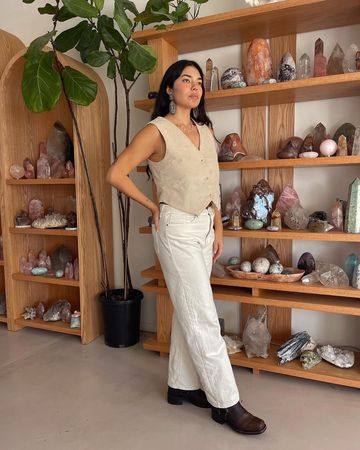 Instagram post by @sacredfem for Just Black Denim. Caption reads: “One thing I wish more people knew about crystals....