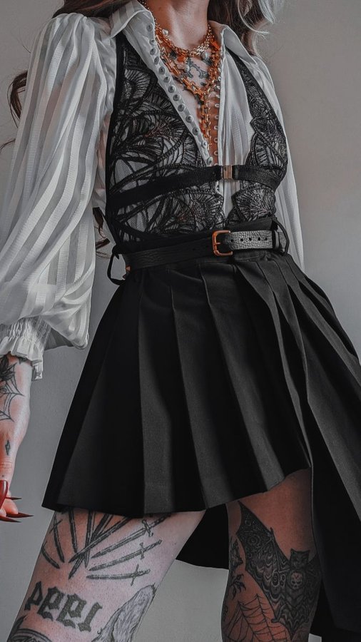 Instagram post by @kllsym for Thistle and Spire. Caption reads: AD| Styling the Onyx Bodysuit from....