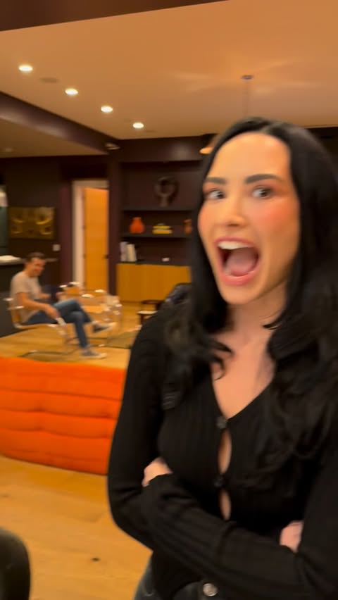 Instagram post by @ddlovato for Airbnb. Caption reads: dinner at mine with my favs 🖤🍽️ thanks to....