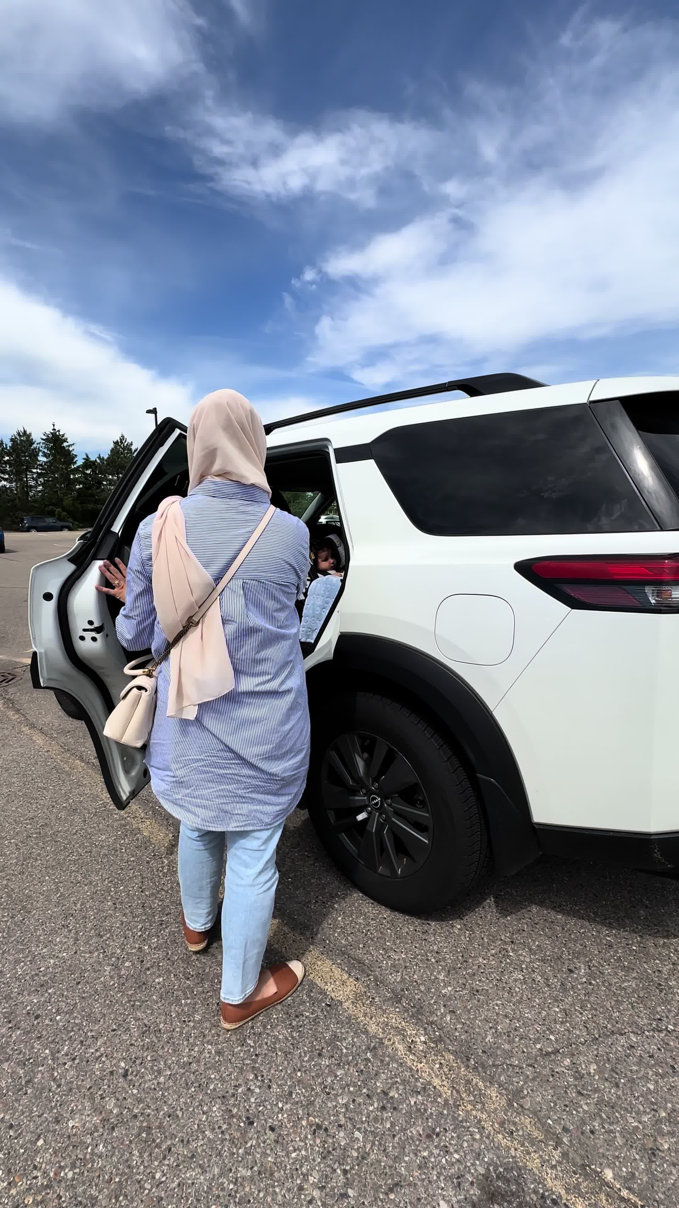 TikTok post by @sincerelymalak for Ergobaby. Caption reads: Took all 4 kids to the grocery store today -....