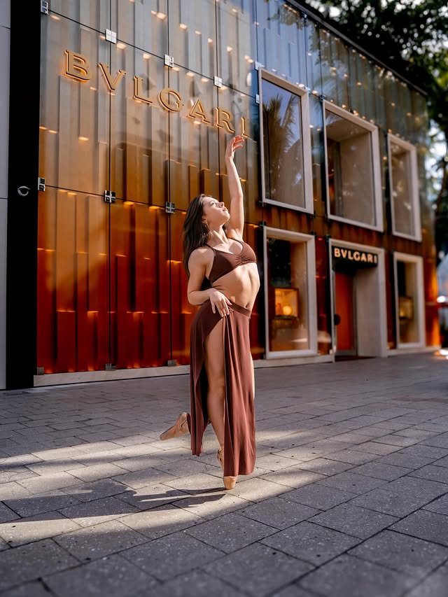Instagram post by @belladarmas for Tiger Friday. Caption reads: Let the light in🤎 Wearing @tigerfridaydancewear....