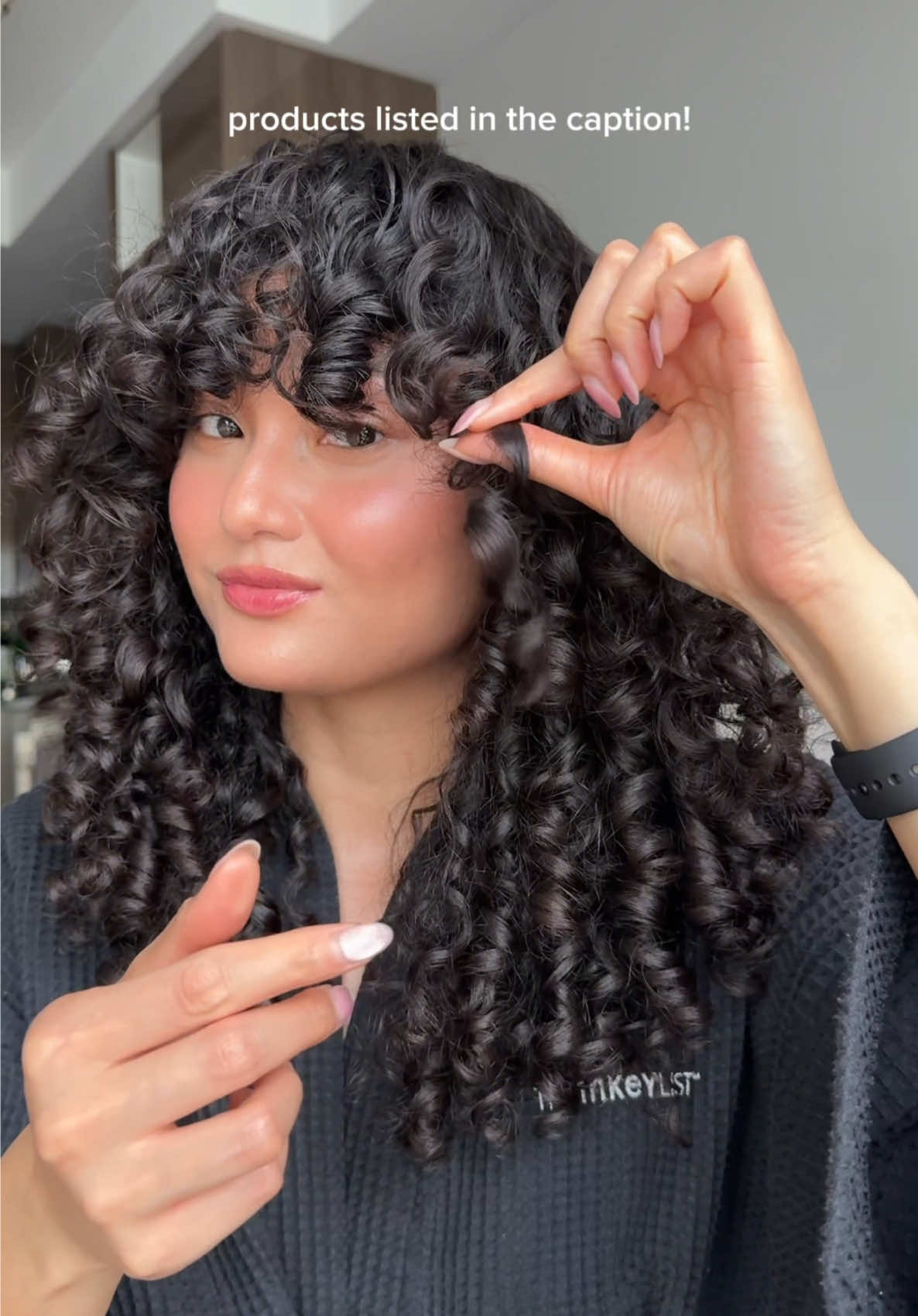 TikTok post by @thatcurllblog for Aveda. Caption reads: how to get chunky curl clumps (my way) 🤠....