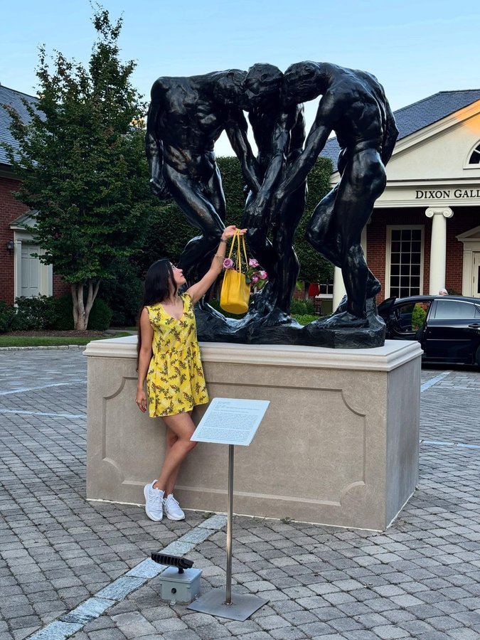 Instagram post by @homarzi for Portland Leather Goods. Caption reads: Carrying sunshine and roses into the gallery💛🌻.