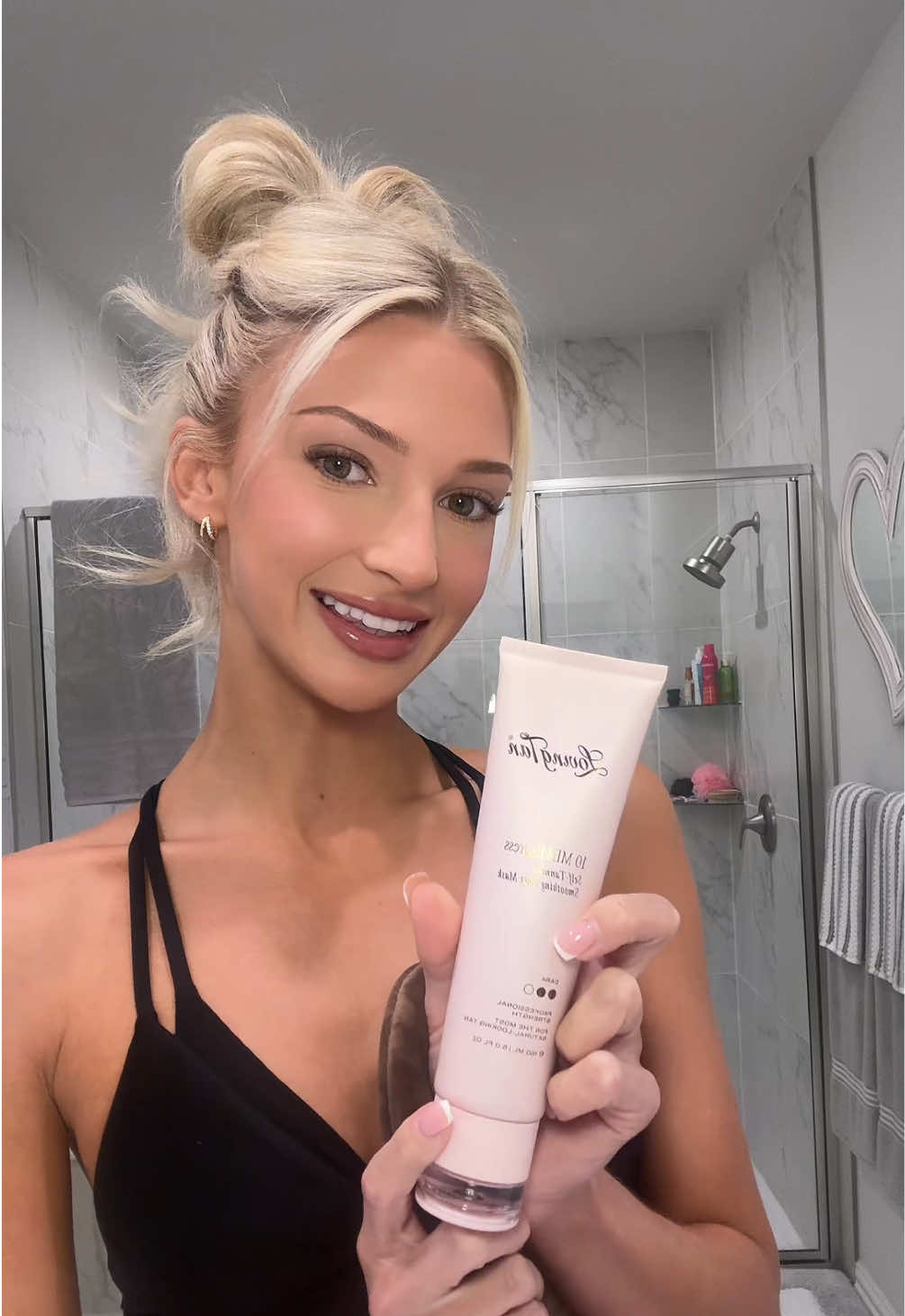 TikTok post by @sophylaufer for Loving Tan. Caption reads: The best quick self tan @Loving Tan 🩷 #selftan....