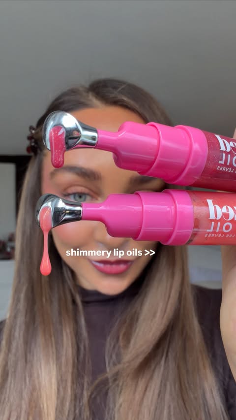 Instagram post by @emilymclarkx for Give Me Cosmetics. Caption reads: [...] off AD #shimmerlipoil #glitterlips....