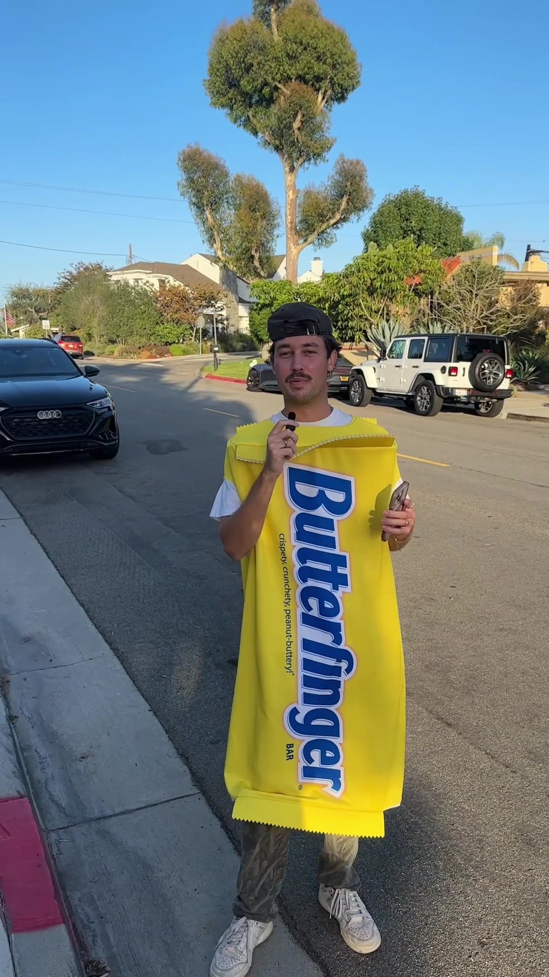 TikTok post by @ghilde for Spirit Halloween. Caption reads: [...] Spirit early with @butterfinger @Spirit....