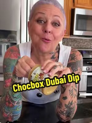 TikTok post by @grayhairandtattoos for CHOCBOX. Caption reads: HELP - I Can’t Stop Eating This! @CHOCBOX ✨....