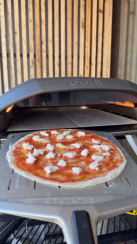 Instagram post by @7thfloorpizza for Ooni. Caption reads: Slow-baked Tonda Romana in the Ooni Koda 2 Pro!....