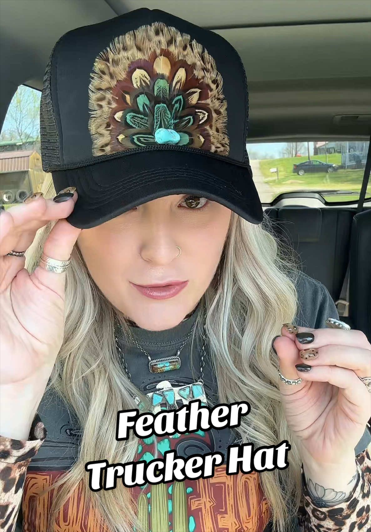 TikTok post by @daniellenlipscomb for Dani Morgans. Caption reads: The feather trucker hat from @Dani Morgan’s....
