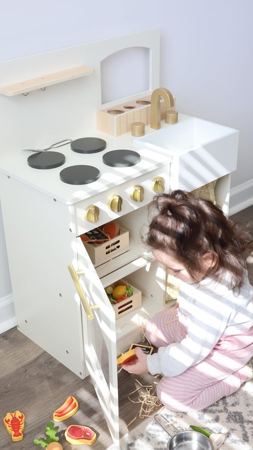 Instagram post by @yelizinamerica for Tiny Land. Caption reads: [...] sweetest little kitchen setup! ✨ The....