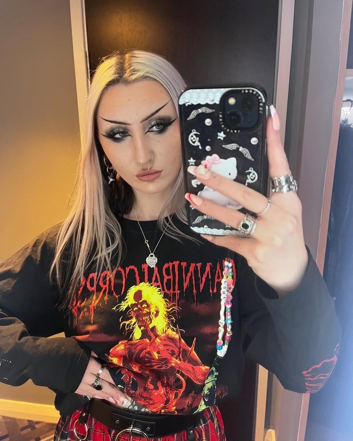 Instagram post by @paras1te.eve for Damaged Society. Caption reads: new year new me except i’m still a raging emo....