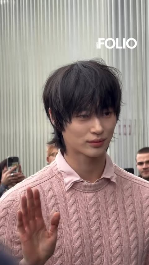 Instagram post by @byeonwooseokfeed for Prada. Caption reads: [...] [📸] Byeon WooSeok has arrived at the Prada....