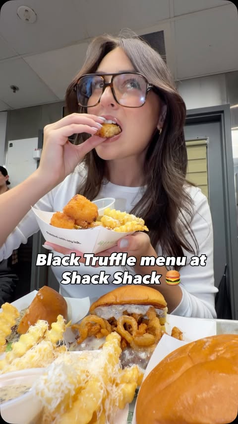 Instagram post by @chewyorkcity for Shake Shack. Caption reads: THE BLACK TRUFFLE MENU IS BACK AT @shakeshack....