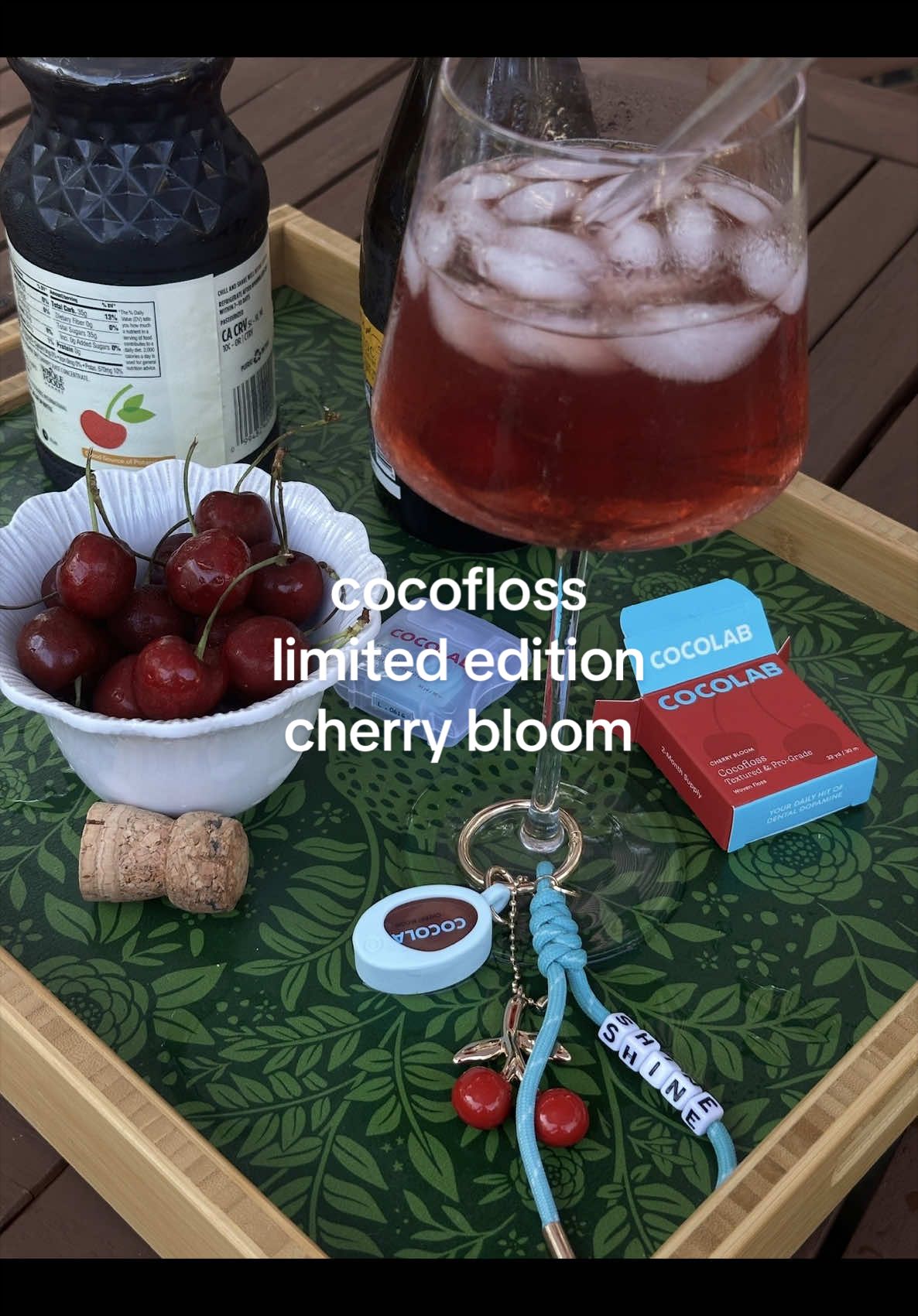 TikTok post by @_juliakane for Cocofloss. Caption reads: [...] cherry bloom flavor 🍒 #cocolab #cocofloss.