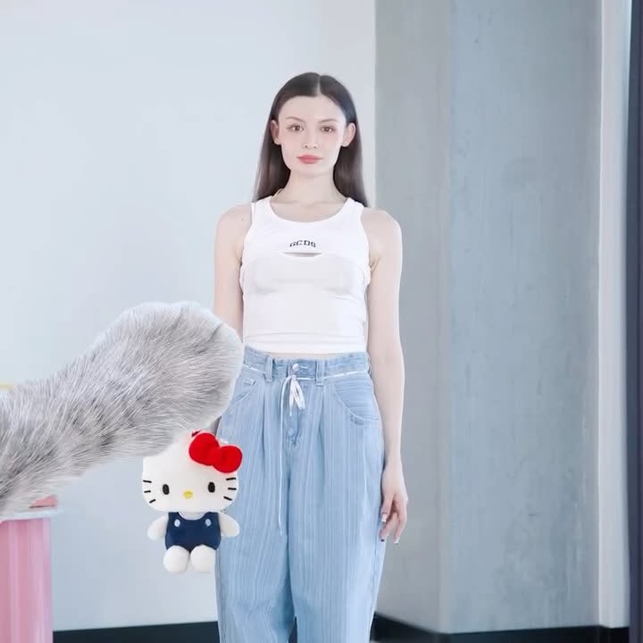 Instagram post by @meeryemcan for GCDS. Caption reads: One hello kitty top, two different city🐈....