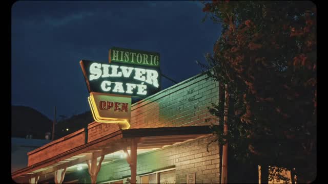 Instagram post by @kylekotajarvi for Travel Nevada. Caption reads: Late nights amidst the neon of Pioche 🎥 There’s....
