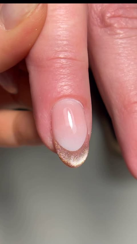 Instagram post by @nailsbyphoebe22 for Madam Glam. Caption reads: French cat-eye magic coming to life ✨ Watch how I....