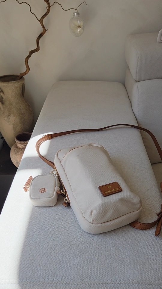 Instagram post by @foreverhomejune19 for Nordace. Caption reads: SIENNA NEXUS PHONE CROSSBODY BAG @nordaceofficial....