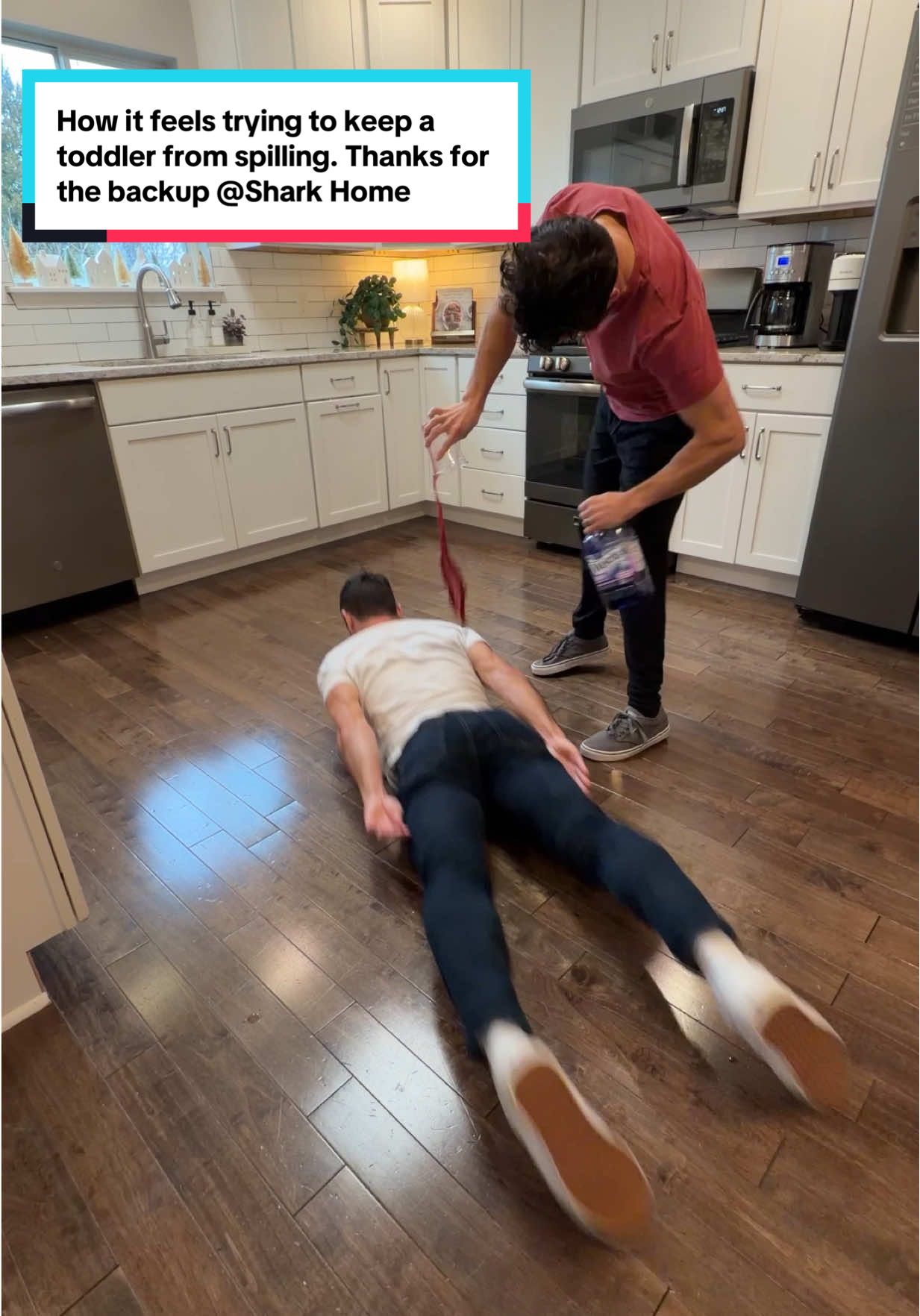 TikTok post by @daniel.labelle for Shark Home. Caption reads: How it feels trying to keep a toddler from....