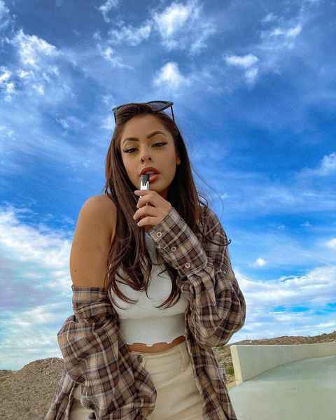 Instagram post by @queenncyn for STIIIZY. Caption reads: Life is better through red eyes 💨
Smoking on the....