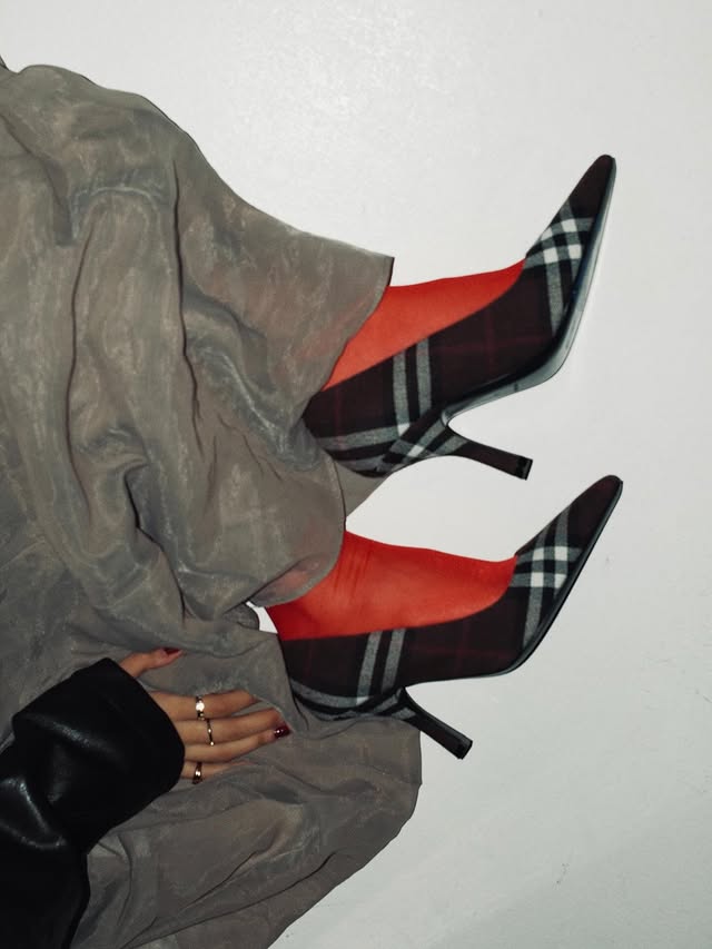 Instagram post by @joudalnamla for Burberry. Caption reads: red has me in a chokehold
@burberry #ad.