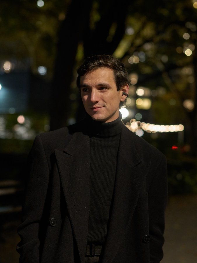 Instagram post by @elliotduprey for Shokz. Caption reads: Cool nights, cool outfits, and cool music with....