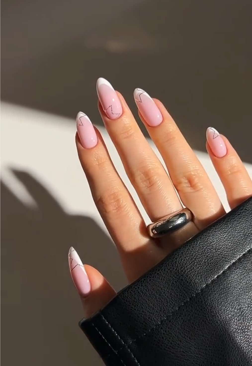 TikTok post by @nailsbypaular for MelodySusie. Caption reads: minimal NYE nails! 🤍🌟🫶🏻🥂 it’s that time of....