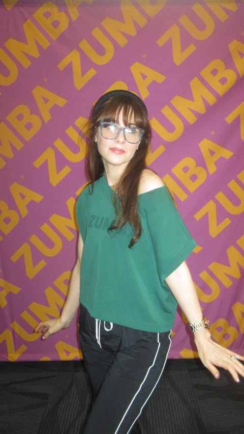 Instagram post by @zooeydeschanel for Zumba. Caption reads: Dancing for 25 years of @zumba! #Zumba25.