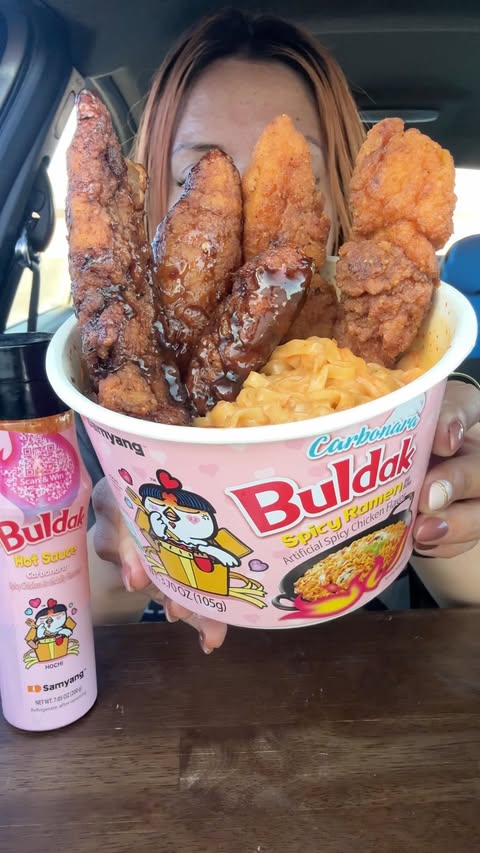 Instagram post by @irisiseating for Buldak. Caption reads: Buldak Ramen and Chicken Strips + Carbonara [...].