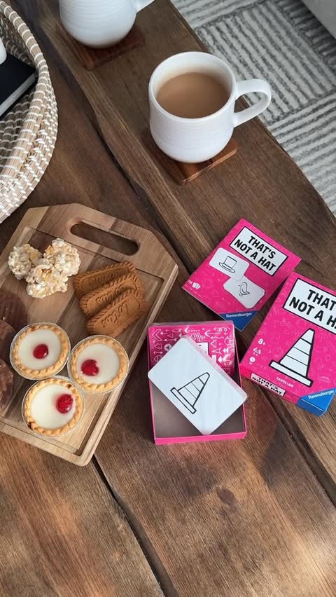 Instagram post by @louisesibley for Ravensburger. Caption reads: A cosy Sunday morning at home 🛋️✨🍫🎲 made so....