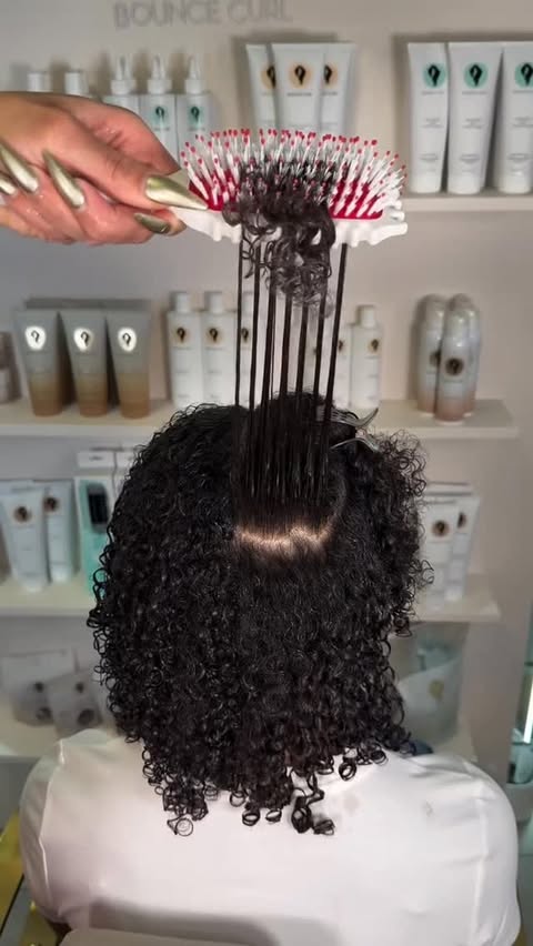 Instagram post by @curly_barbie for BounceCurl. Caption reads: The new @bouncecurl brushes 😍 The best definition....
