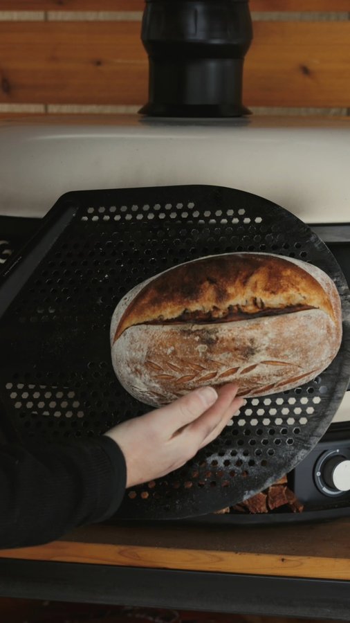 Instagram post by @livefireaaron for Gozney. Caption reads: A fresh sourdough loaf in the Gozney Dome. There's....