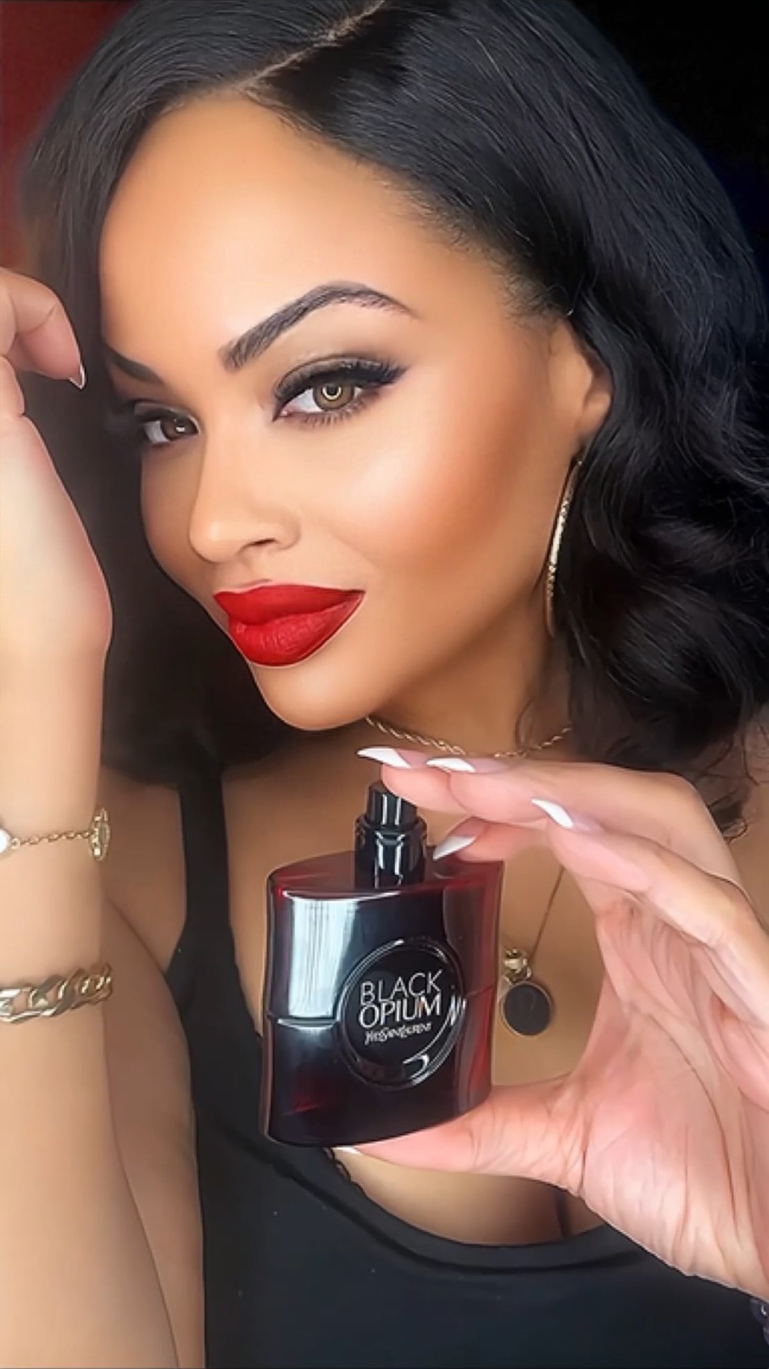 Instagram post by an influencer for YSL Beauty. Caption reads: [...] captivate your senses with @yslbeauty and....