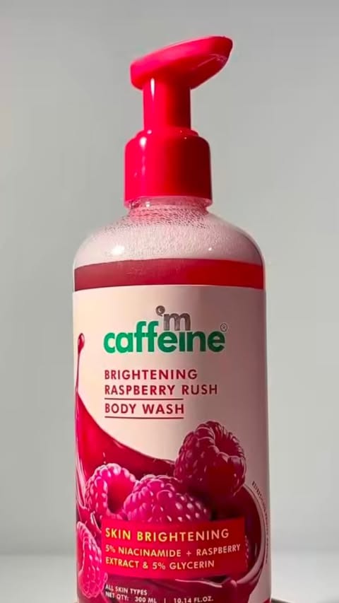 Instagram post by @_butter_fly_sky_26 for mCaffeine. Caption reads: [...] showers into a berry-fresh ritual 🫐🍓🫧....