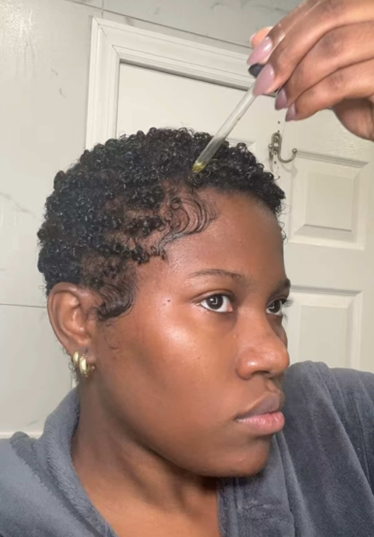 TikTok post by @glowellc for DevaCurl. Caption reads: [...] extreme gel @The Doux Hair Care mouse....