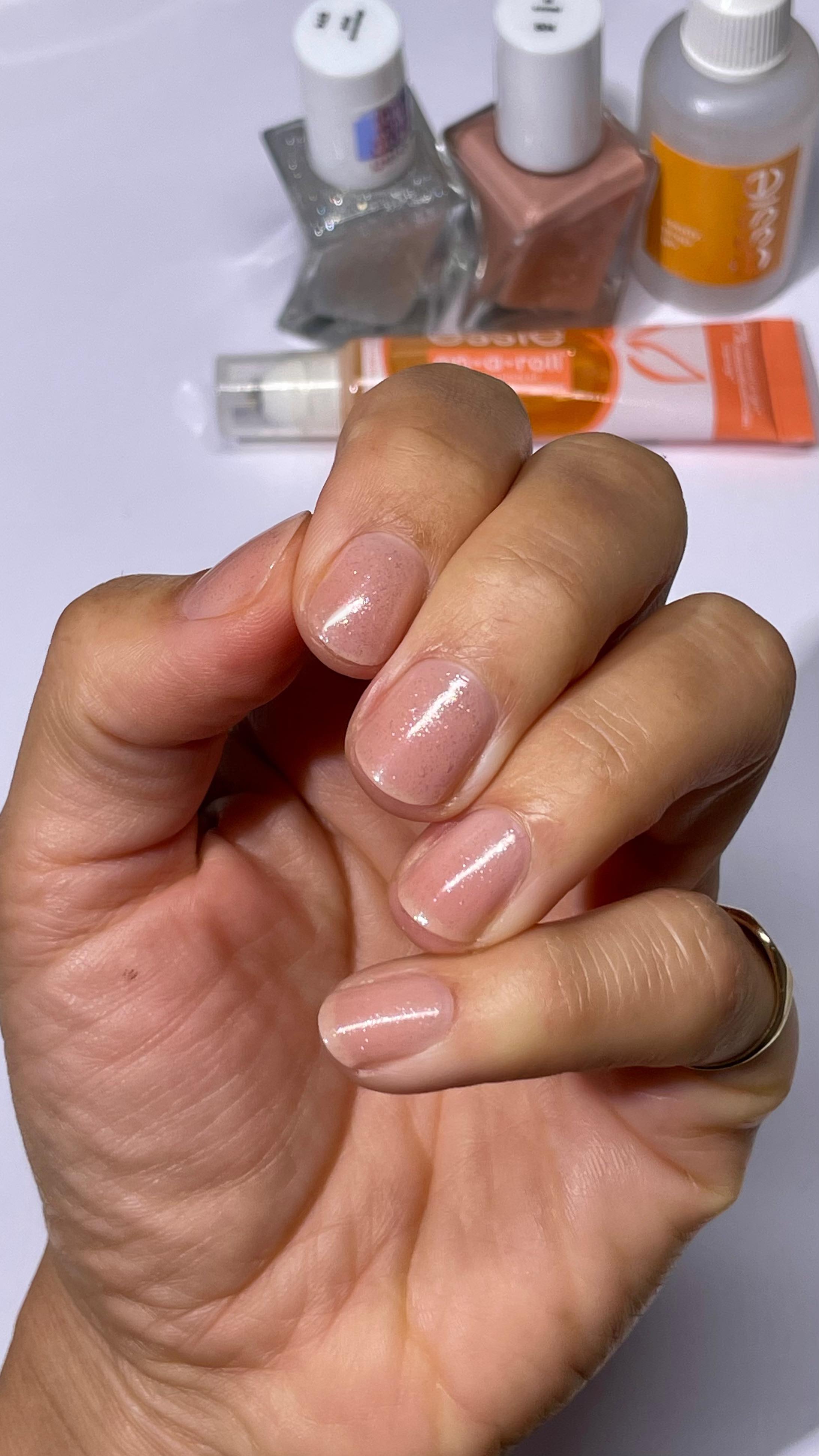 Instagram post by @nailsbymh for essie. Caption reads: #ad 🤩 Soft nude, shimmer finish - no UV lamp....