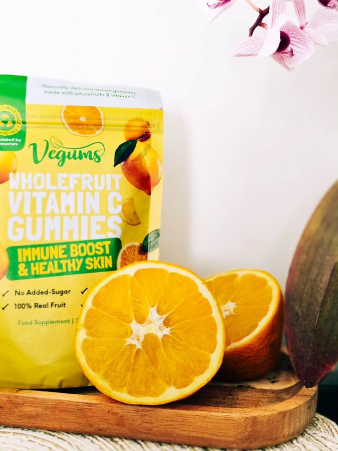 Instagram post by @mama_2_lola_priya for Vegums. Caption reads: [...] system’s love language is gummies 🍊 @vegums....